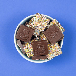 Free From Family Co Christmas Squares Mylk Choc Sprinkles 100g